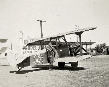 Paul Richter preparing the Curtiss aircraft for flight.
